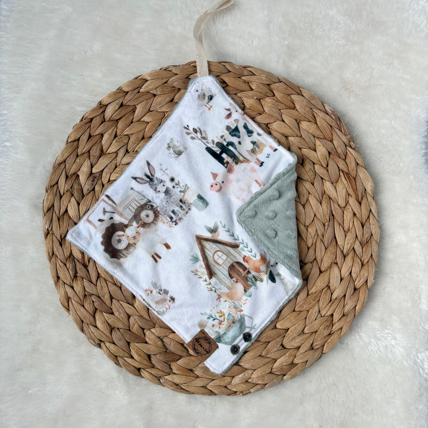 Doudou attache-suce prête-à-partir