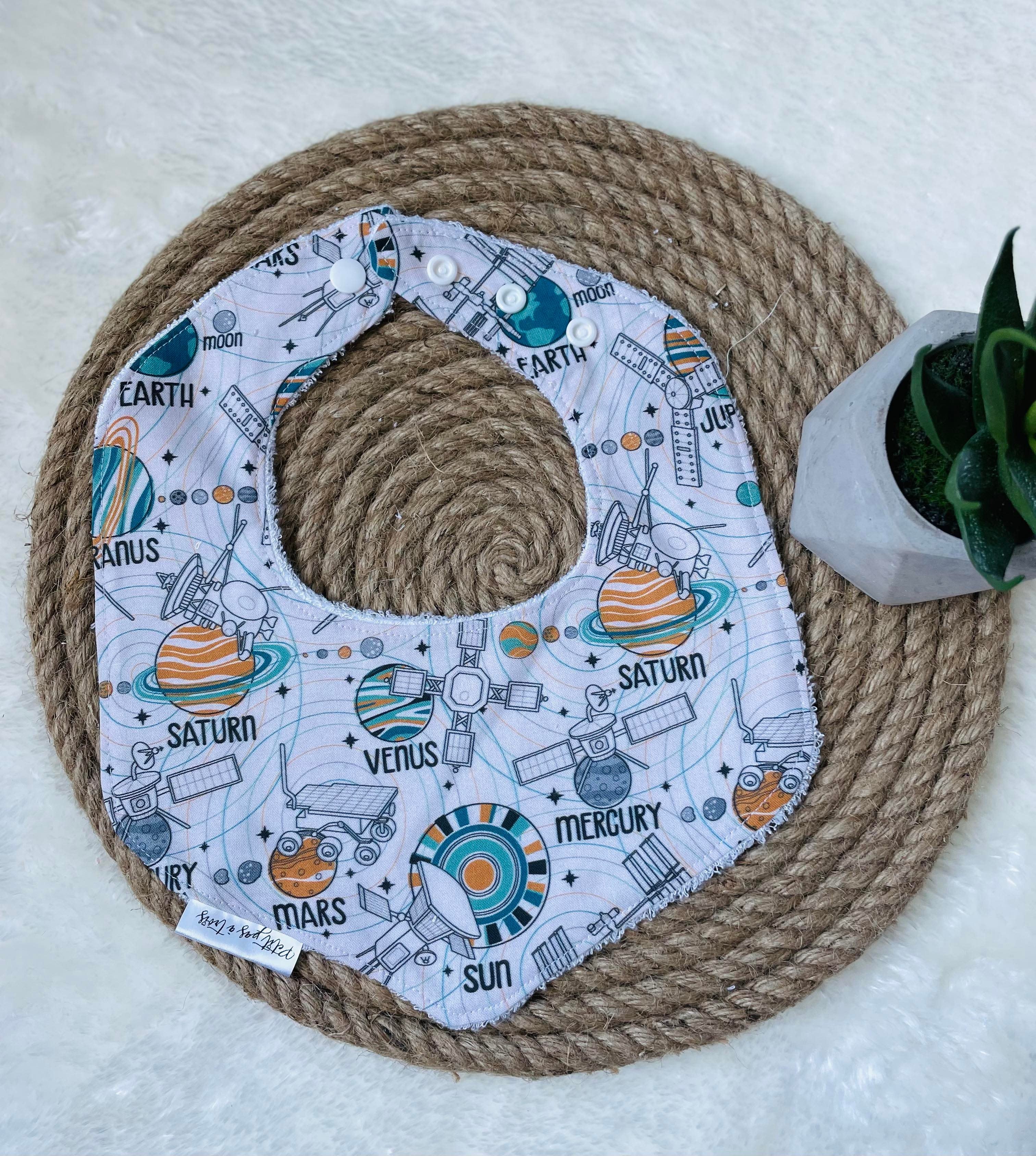 Bavoir évolutif - Planètes