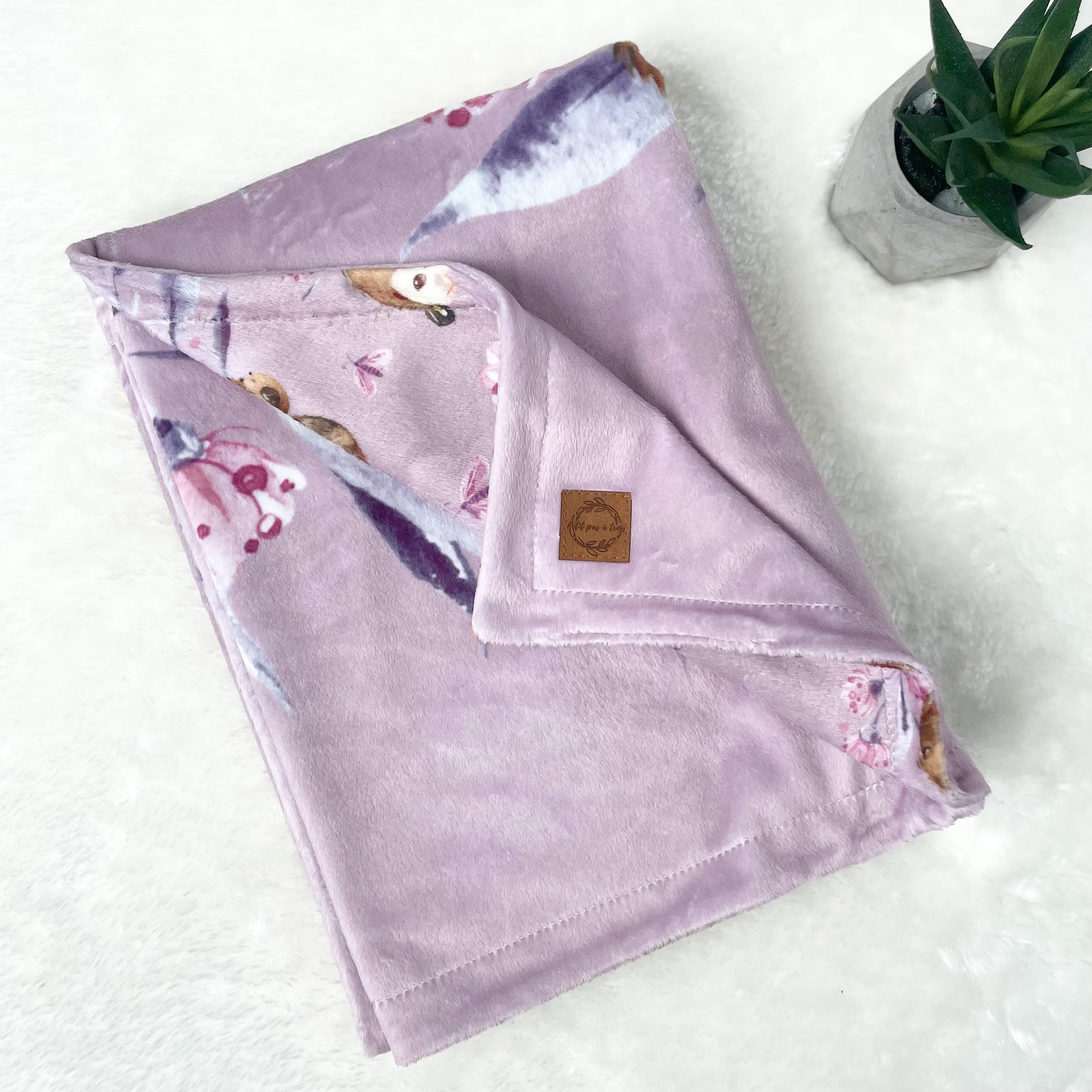 Doudou recto-verso - Loutres fond mauve